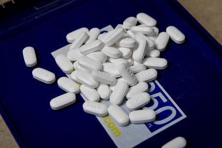 Factbox-Pharmacies, drug companies settle lawsuits over U.S. opioid crisis