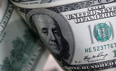 Dollar loses ground after Fed raises rates, forecasts more hikes