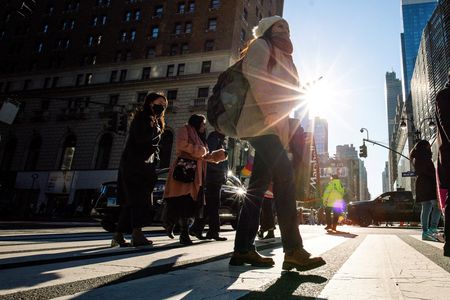 Global 2023 economic view downgraded, at odds with market optimism