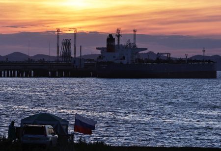 Oil prices settle steady on higher U.S. demand, weaker dollar