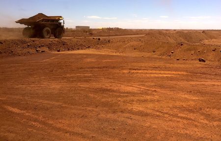 Australia’s iron ore giants face earnings, dividend plunge