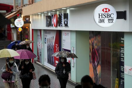 HSBC cuts staff bonus pool, lifts CEO Quinn’s total pay