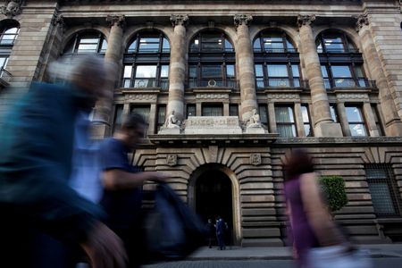 Banxico boosts rate more-than-expected, signals smaller hikes ahead